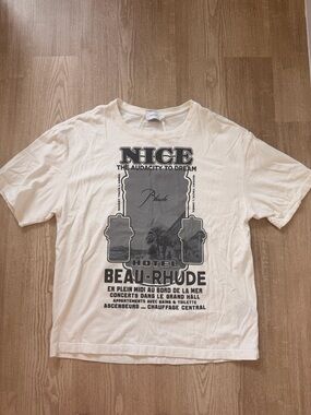 Rhude Cream Graphic 'Nice Hotel Beau-Rhude' Short Sleeve Tee